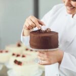 Wilton Decorate Smart Ultimate Trim N Turn Cake Caddy Wilton Decorate Smart Ultimate Trim N Turn Cake Caddy - Convenient storage and rotating feature for easy cake decorating