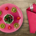 What Do I Use to Decorate a Christmas Cake Naturally Natural decorations like fresh berries and herbs bring a festive touch to a Christmas cake