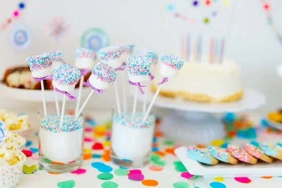 Mickey Mouse-shaped cake with colorful frosting and creative decorations for birthday celebrations