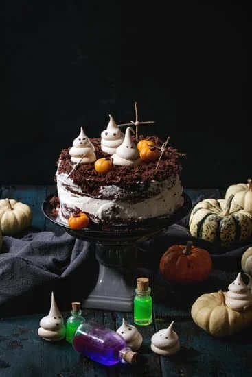 Delicious white cake adorned with elegant black and gold decorations for a stunning visual treat