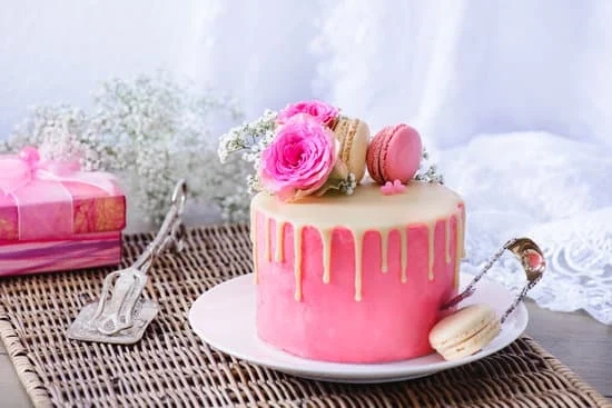 Close-up view of a beautifully decorated cake with letter imprints, showcasing expert cake decorating skills
