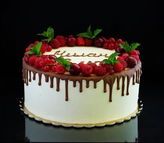 Decorating a Lemon Blueberry Cake 1 Image of a beautifully decorated lemon blueberry cake with luscious frosting and vibrant fruit toppings