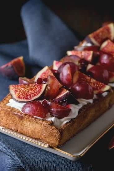 Decorating Cake With Fruit 1 Deliciously decorated cake adorned with fresh and vibrant assortment of fruits
