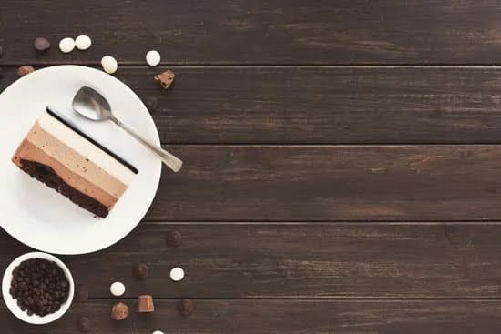 Wedding Cake Table Decoration 1 Elegant wedding cake table decoration with flowers, candles, and delicate fabric draping