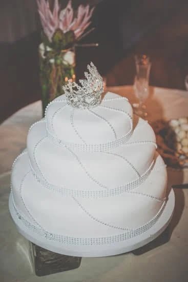 Birthday decorations for a stunning hundred cake with colorful balloons and festive party accessories