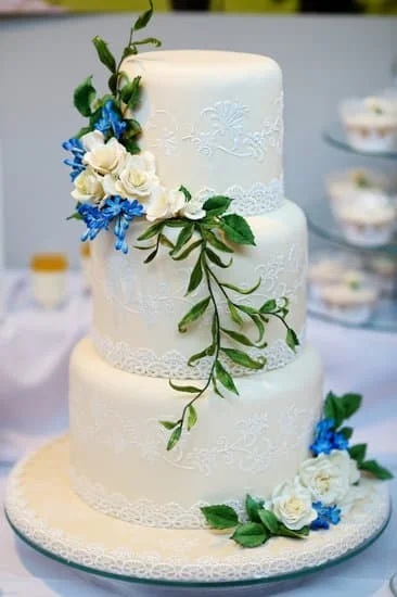 Creative cake decorator expertly working on a beautifully designed cake creation