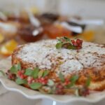 Image of participants at the prestigious INTERNATIONAL CAKE DECORATING COMPETITION showcasing their intricate creations