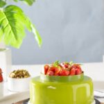 Merry Christmas Cake Decoration Festive holiday-themed cake with 'Merry Christmas' written in elegant icing alongside decorative ornaments