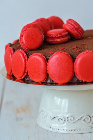 Delicately piped whipped cream frosting adorns a beautifully decorated cake