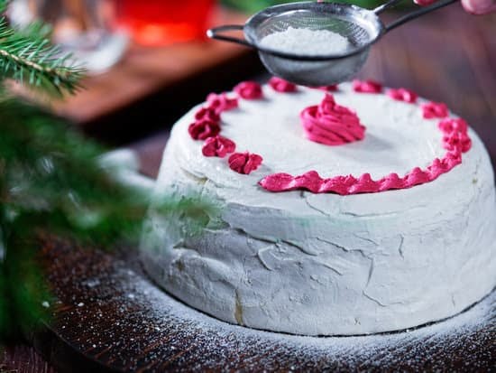 Vibrant and Delicious Cake Decorated with Fresh Fruit and Colorful Flowers