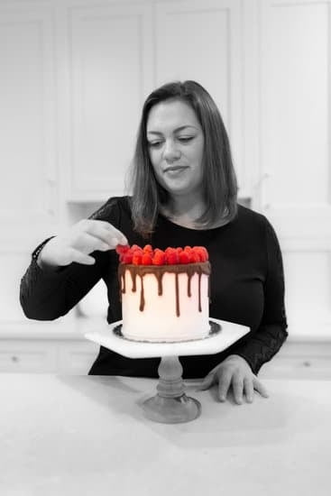 Step-by-step guide on attaching fondant decorations to a fondant cake for a flawless finish