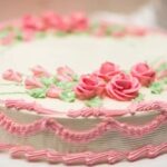 Close-up of beautifully decorated cake adorned with succulent-shaped fondant decorations