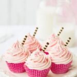 Vibrant black and yellow cake decoration with elegant designs and intricate details