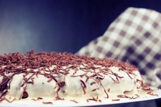 Cherry decorated cake with layers of moist sponge and a rich cream frosting