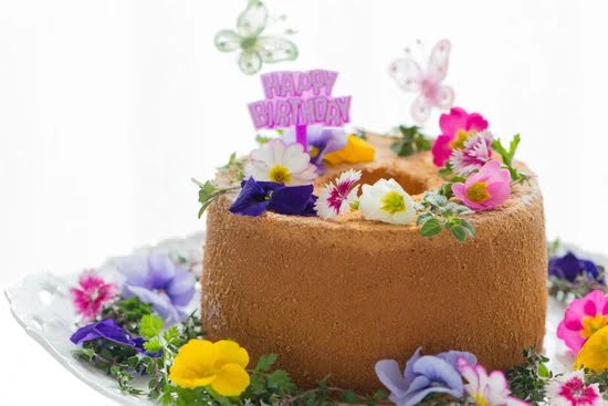 Beautifully decorated Rasmalai cake with intricate designs and a touch of elegance