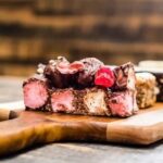 Assorted cake decorating accessories including icing tips, edible pearls, and cake spatulas