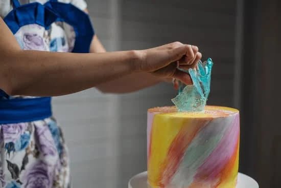 Variety of tools to decorate a cake, including piping bags, tips, and fondant cutters