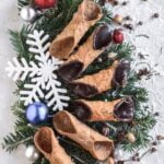 Decadently adorned fruit cake with marzipan icing, cherries, and almonds