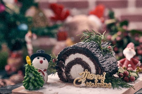 Delicious carrot cake decorating with cream cheese frosting and edible flowers for a stunning dessert