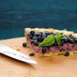Ideas for Decorating Carrot Cake Deliciously decorated carrot cake with cream cheese frosting and colorful edible flowers for a stunning dessert idea