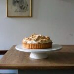 Step-by-step guide on how to make edible crystal cake decorations using sugar, food coloring, and molds