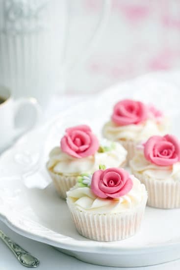 To Decorate a Cake 1 Using piping bag to decorate a cake with vibrant colors and intricate designs