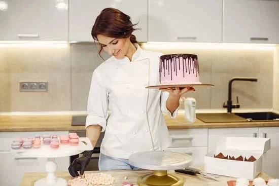Decorating an Easter cake with pastel-colored frosting, chocolate eggs, and festive bunny decorations