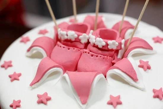 Prepping cake pops for decorating by freezing can help them hold their shape