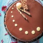 How to Decorate Carrot Cake Cupcakes How to decorate carrot cake cupcakes: Piped cream cheese frosting, edible carrot decorations, and a sprinkle of cinnamon