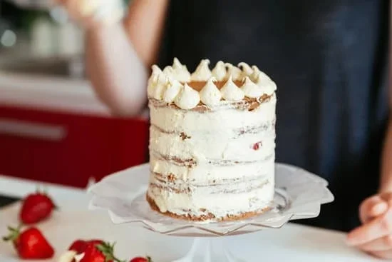 Moist and delicious carrot cake decorated with cream cheese frosting, perfect for any special occasion