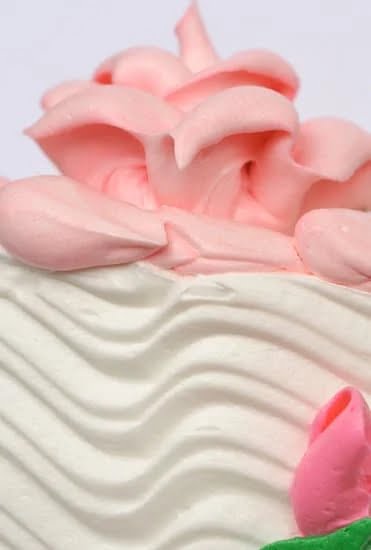 Decorating Ideas for Carrot Cake 1 Delicious carrot cake with cream cheese frosting, topped with walnuts and edible flowers for a stunning presentation