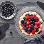 How to Decorate a Sheet Cake With Strawberries Decorated sheet cake topped with fresh strawberries and whipped cream for a delicious finish