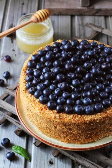 vibrant yellow icing, fresh lemon slices, and edible flowers
