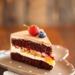Christmas-themed carrot cake with cream cheese frosting and festive decorations, ideal for holiday celebrations