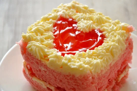 Step-by-step guide on how to decorate homemade chocolate cake with icing and sprinkles
