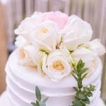How to Decorate a Ganache Cake Step-by-step guide on how to decorate a ganache cake with chocolate shavings and edible flowers