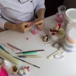 How to Decorate Black Forest Cake chocolate shavings, cherries, and a dusting of powdered sugar