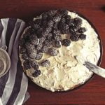 How to Decorate Coconut Cake coconut shavings, toasted coconut, and edible flowers on top