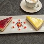 Heart-shaped cake with pink frosting, sprinkles, and 'How to Decorate Heart Shape Cake' tutorial