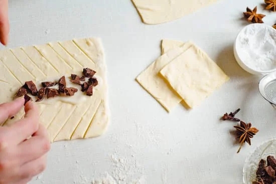 Step-by-step guide on how to stick decorations on cake for a beautiful finish